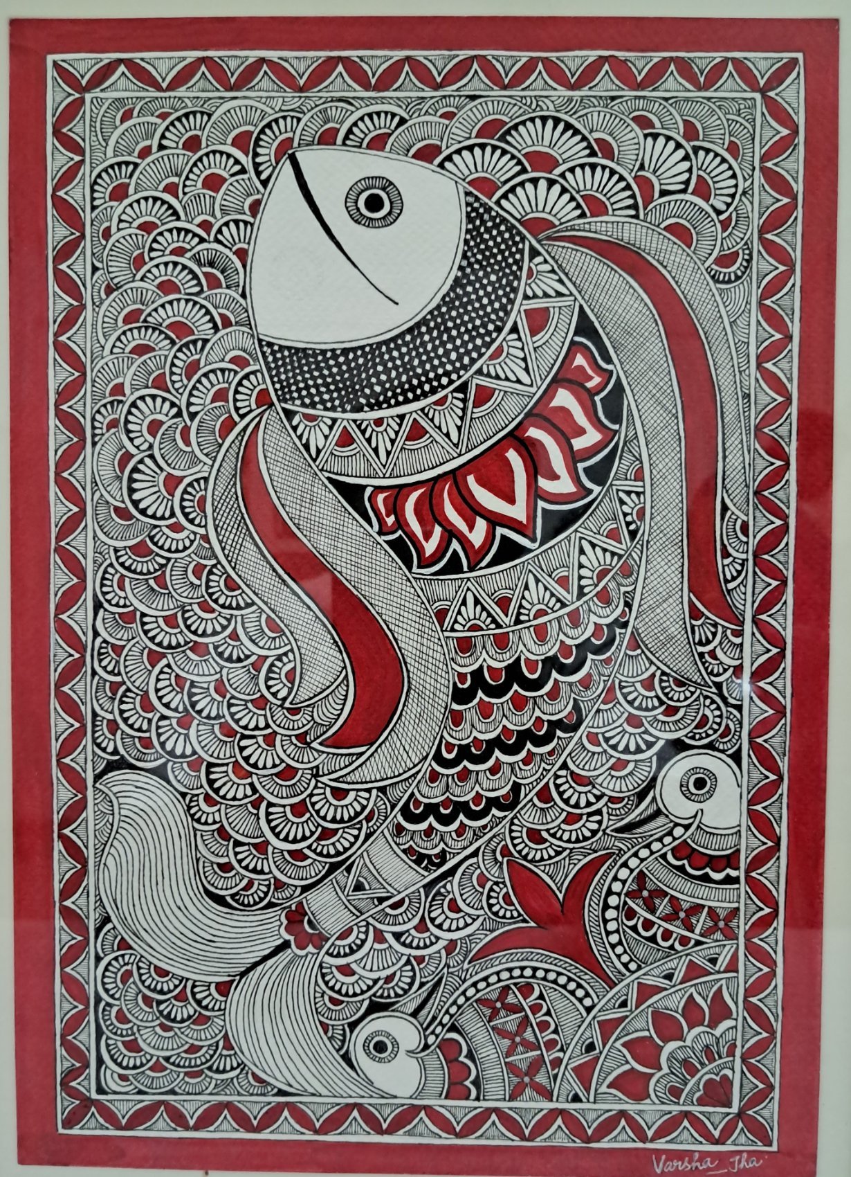 Kachni-style Madhubani painting of a large fish and two smaller fish drawn in fine black lines with red accents