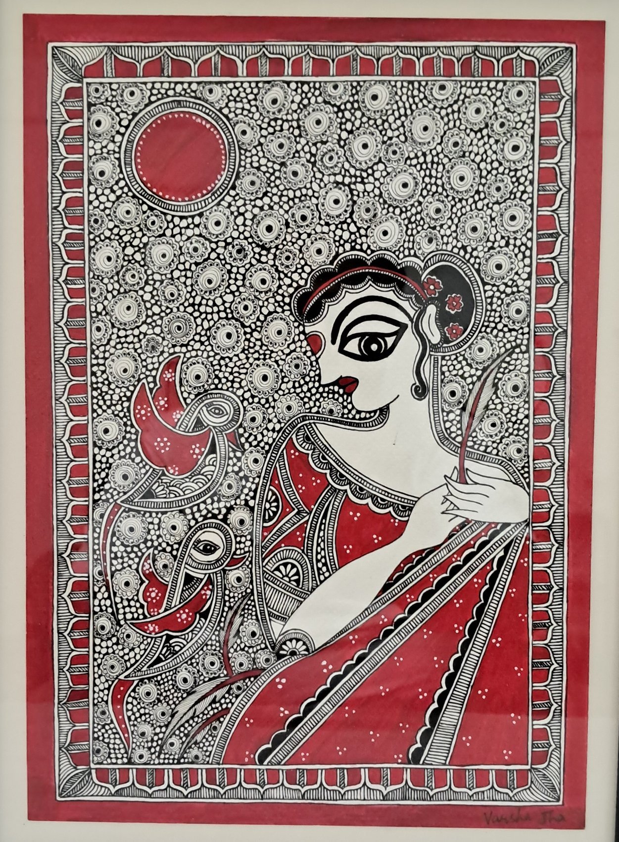 Madhubani portrait of a woman in profile holding a feather, with a parrot beside her and a red sun, in red, black and white